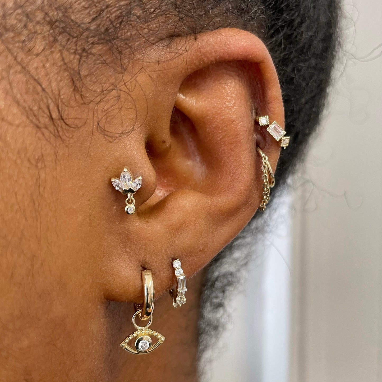 9k solid yellow gold Sateria huggie earring pair