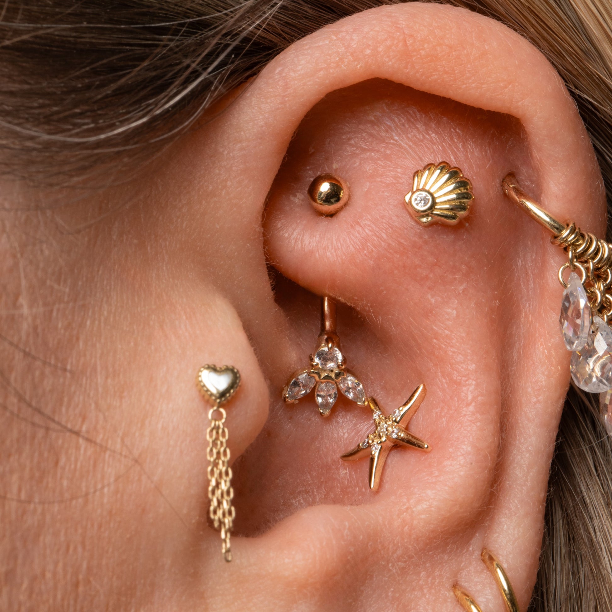 9k solid yellow gold Lotus Flower banana bar Banana Bars Laura Bond Maria Tash astrid miyu