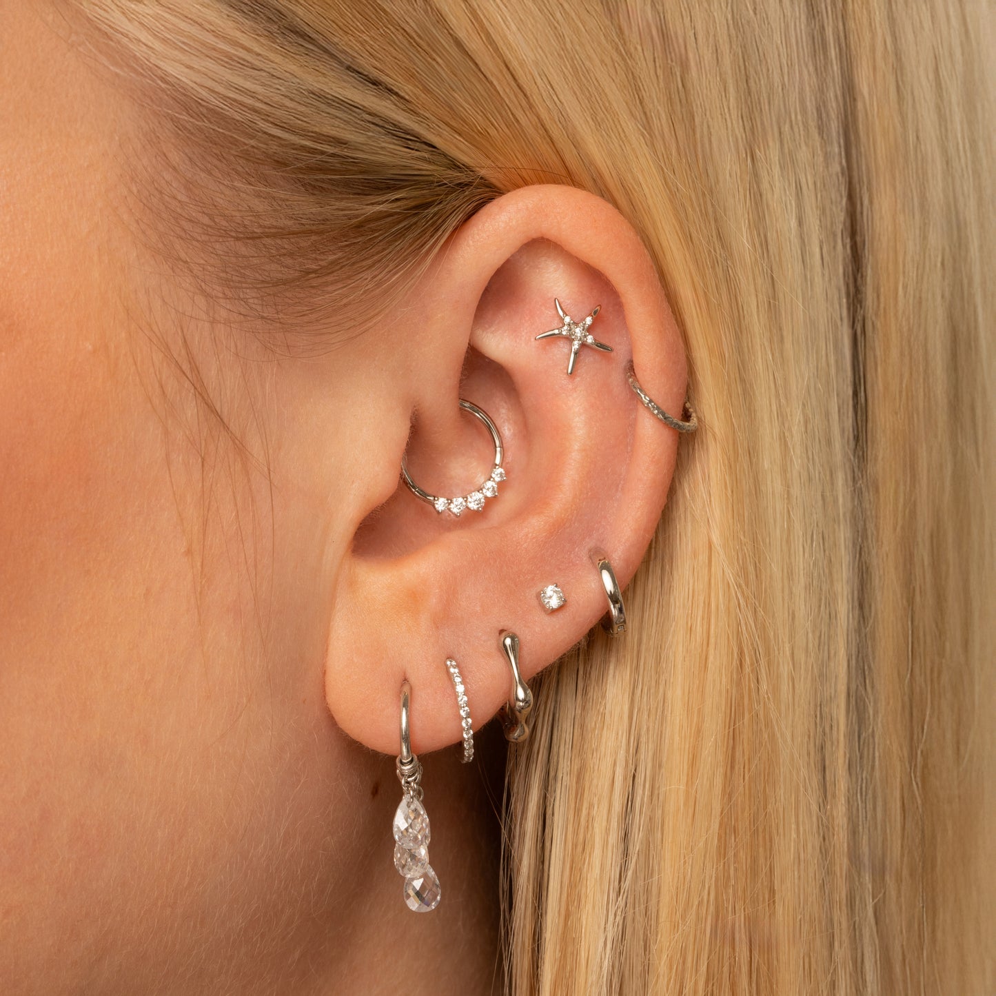 astrid miyu 9k solid white gold Wave huggie hoop earring 8mm Huggies and Hoops Laura Bond
