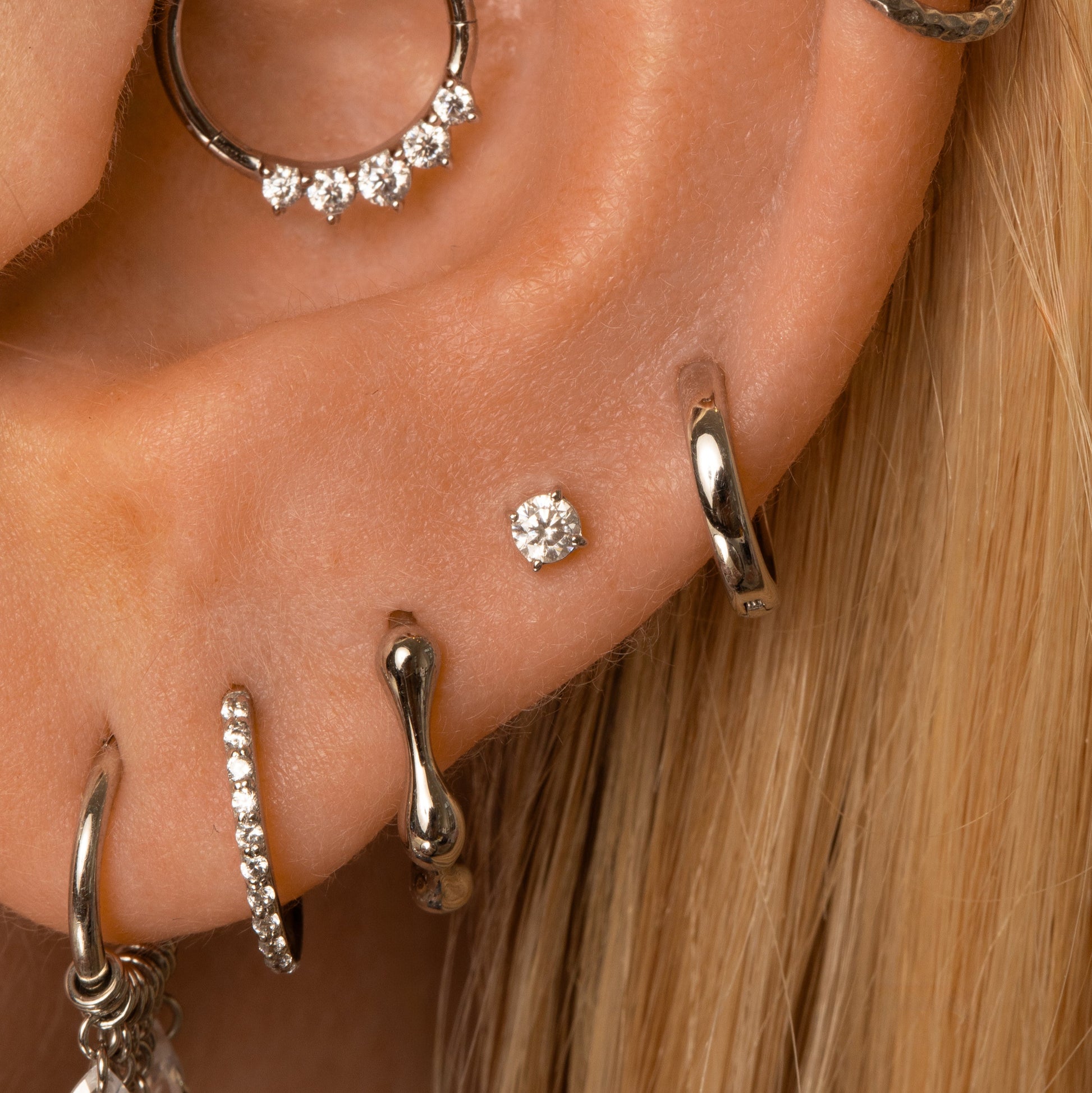 astrid miyu 9k solid white gold Wave huggie hoop earring 8mm Huggies and Hoops Laura Bond