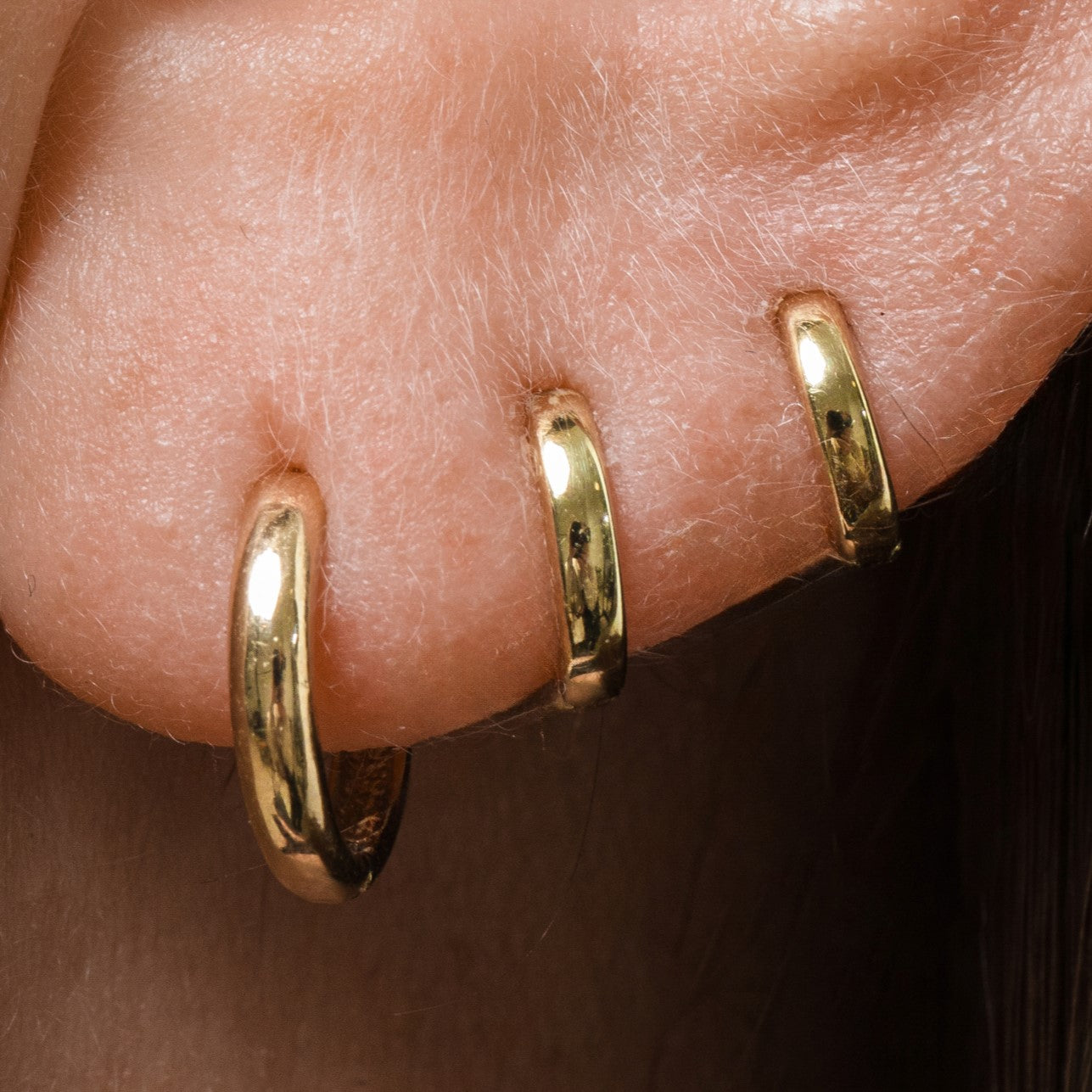 9k solid yellow gold simple huggie earring Huggies and Hoops Laura Bond Maria Tash