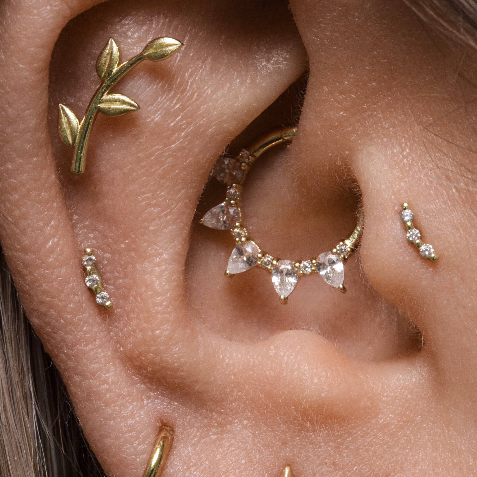 astrid miyu 14k solid yellow gold 9mm Dreamer pear cut hoop for daith or septum Laura Bond