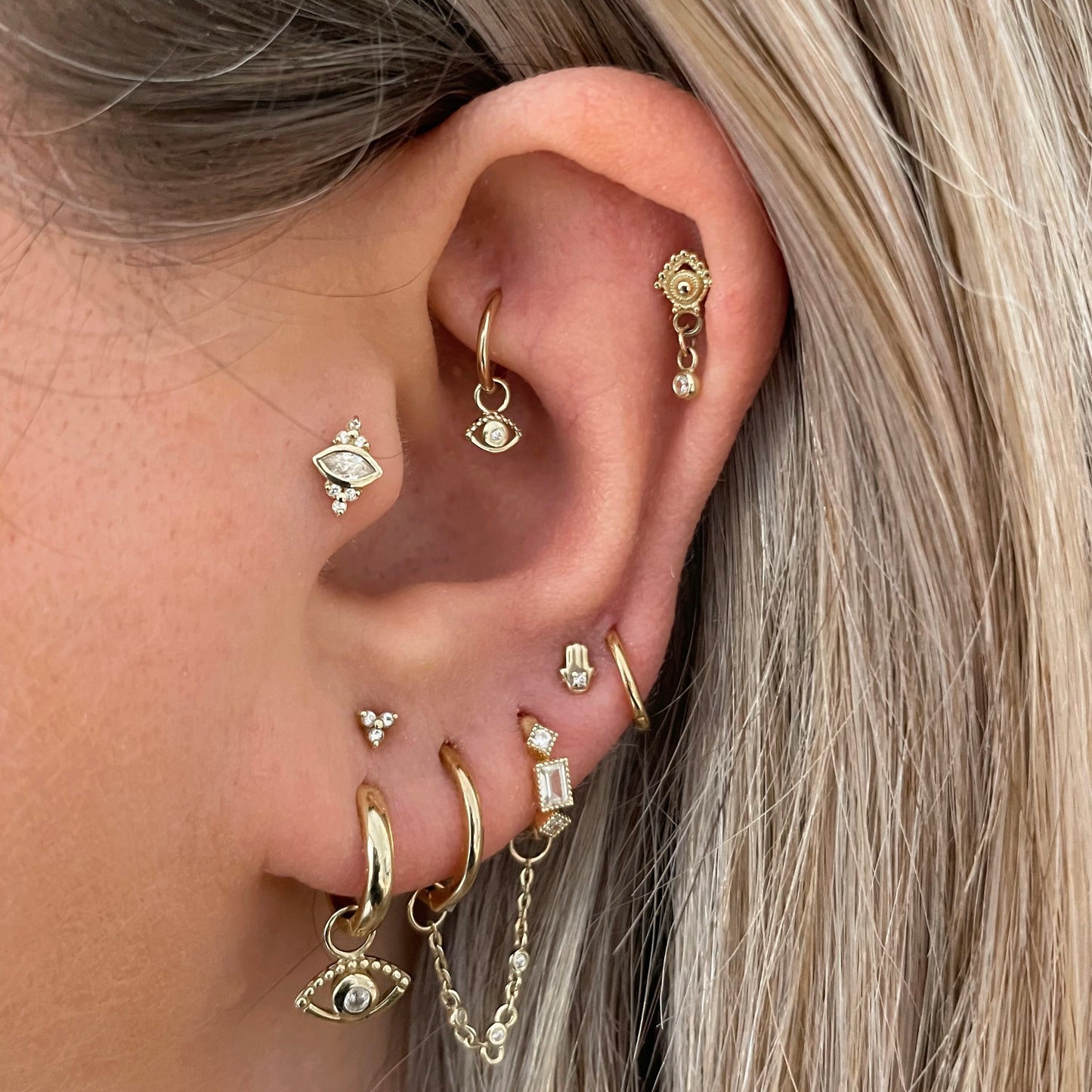9k solid yellow gold Sateria huggie earring pair