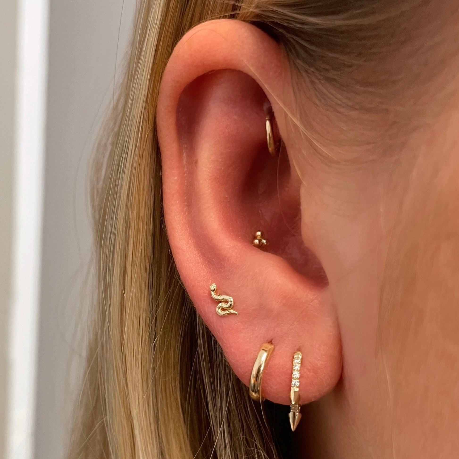 9k solid yellow gold tiny serpent flat back labret stud earring - LAURA BOND jewellery